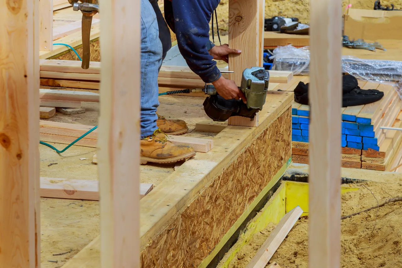 Contractor working on an exterior wall
