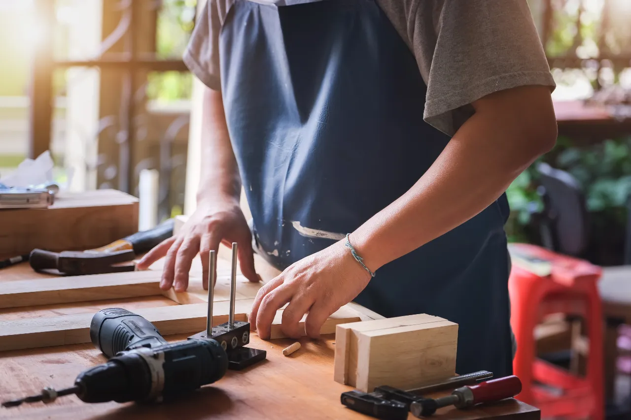 Carpenter shaping wood in the workshop in Bridgeport, CT
