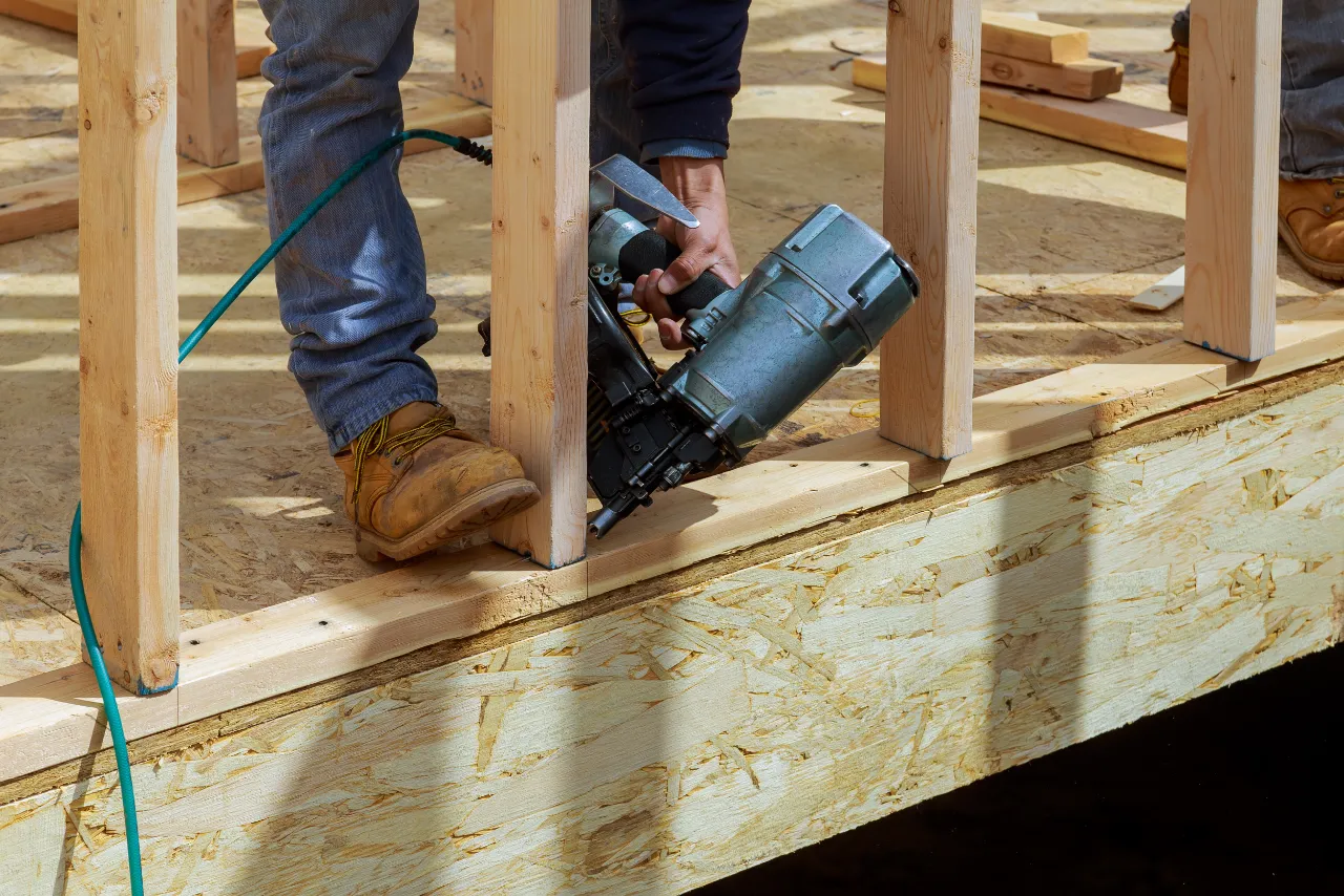 Contractor framing walls during a kitchen renovation