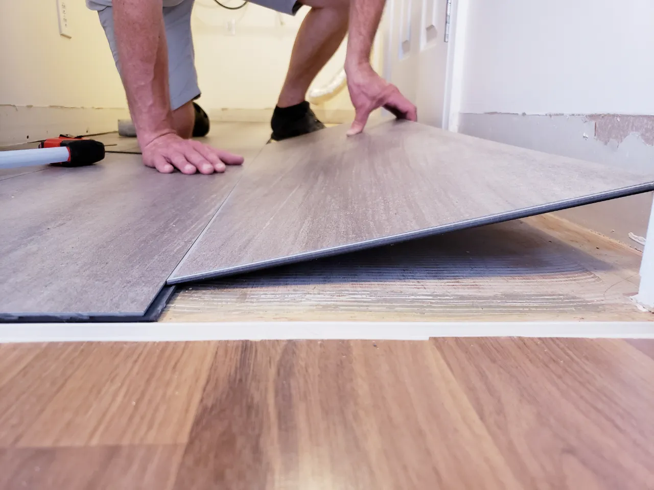 Floor level view of laminate flooring installation