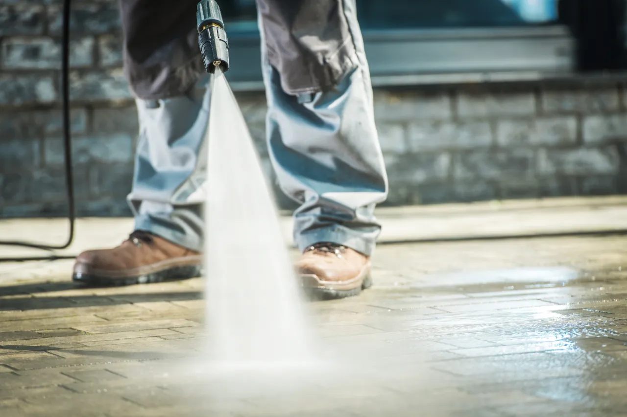 Outdoor concrete cleaned with controlled pressure