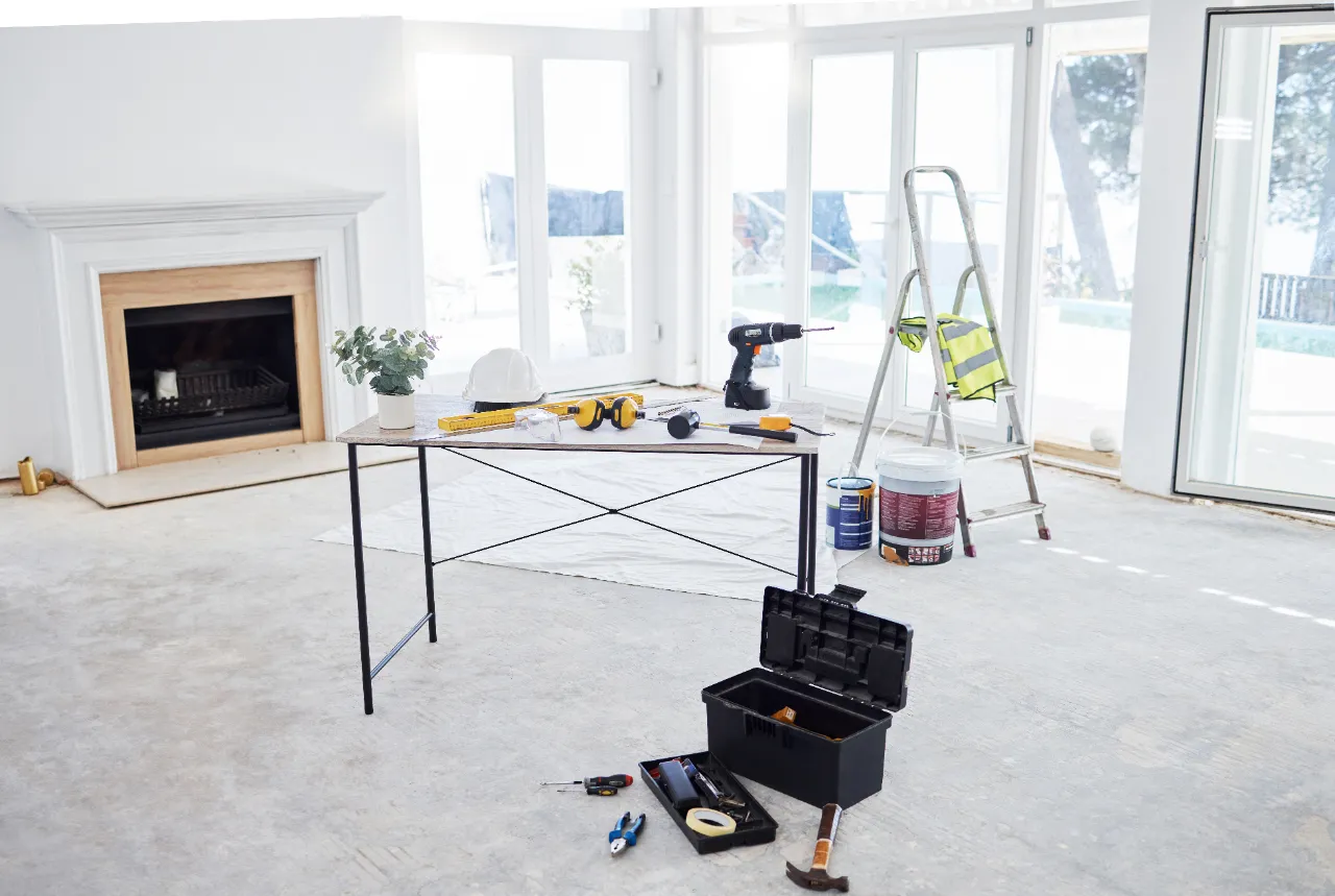 Building plans and equipment on a table during project planning