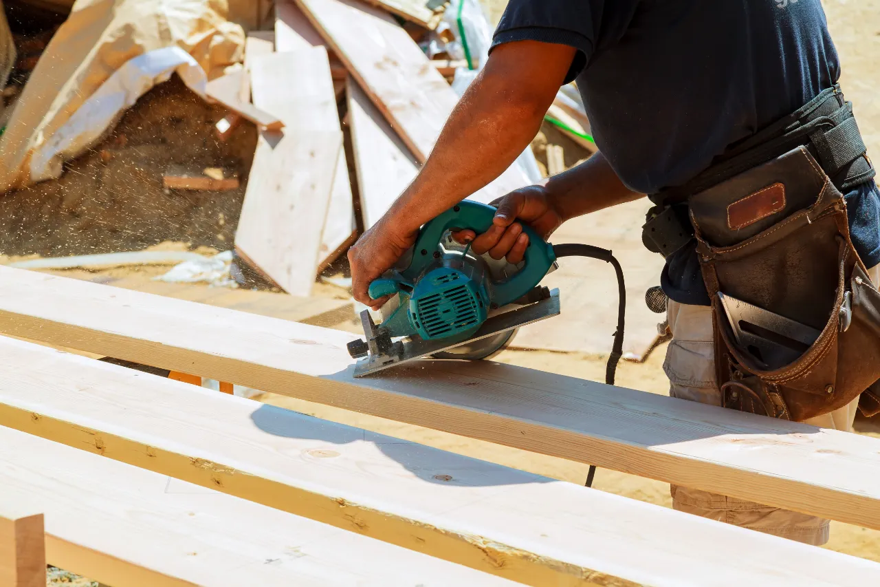 Cutting lumber with a power saw in Bridgeport, CT