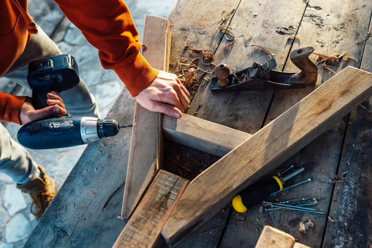 Drilling into a wooden bar in Greenwich, CT